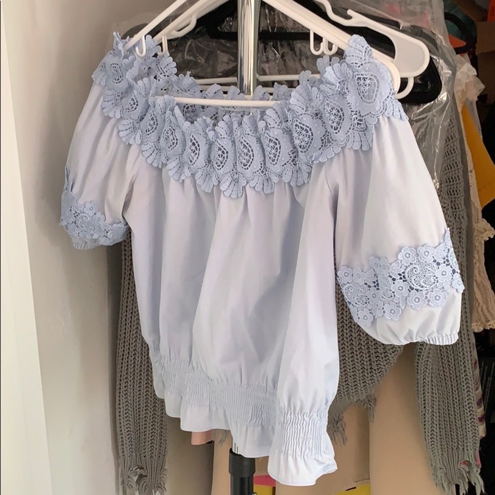 Blue short sleeves shirt with see-through neck